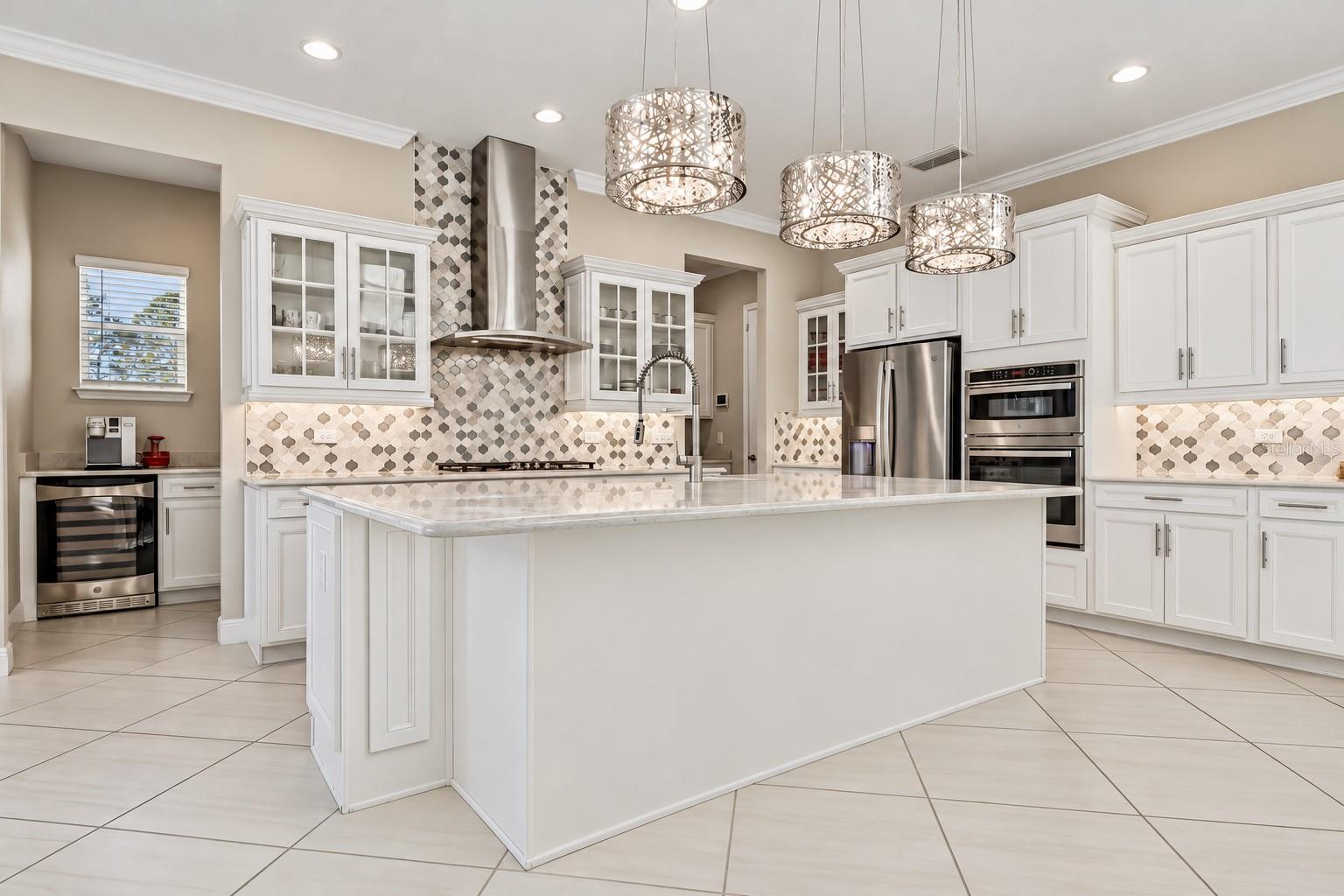 The stylish kitchen anchors the versatile main floor.