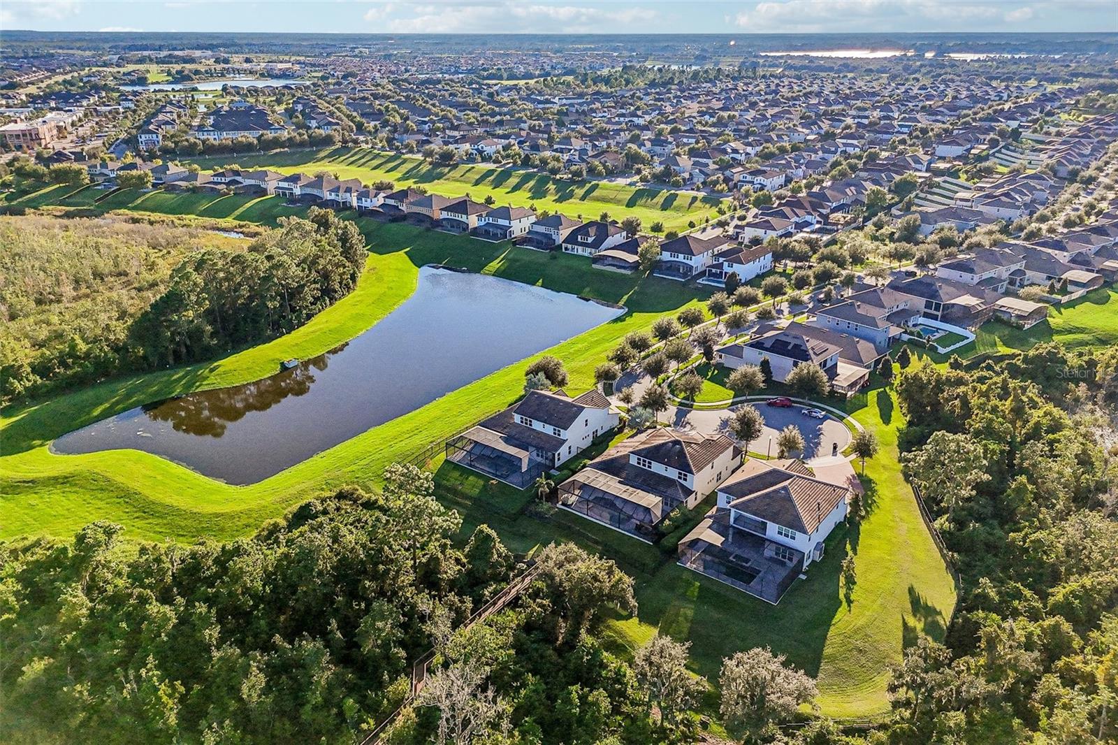 Mature trees and water views.