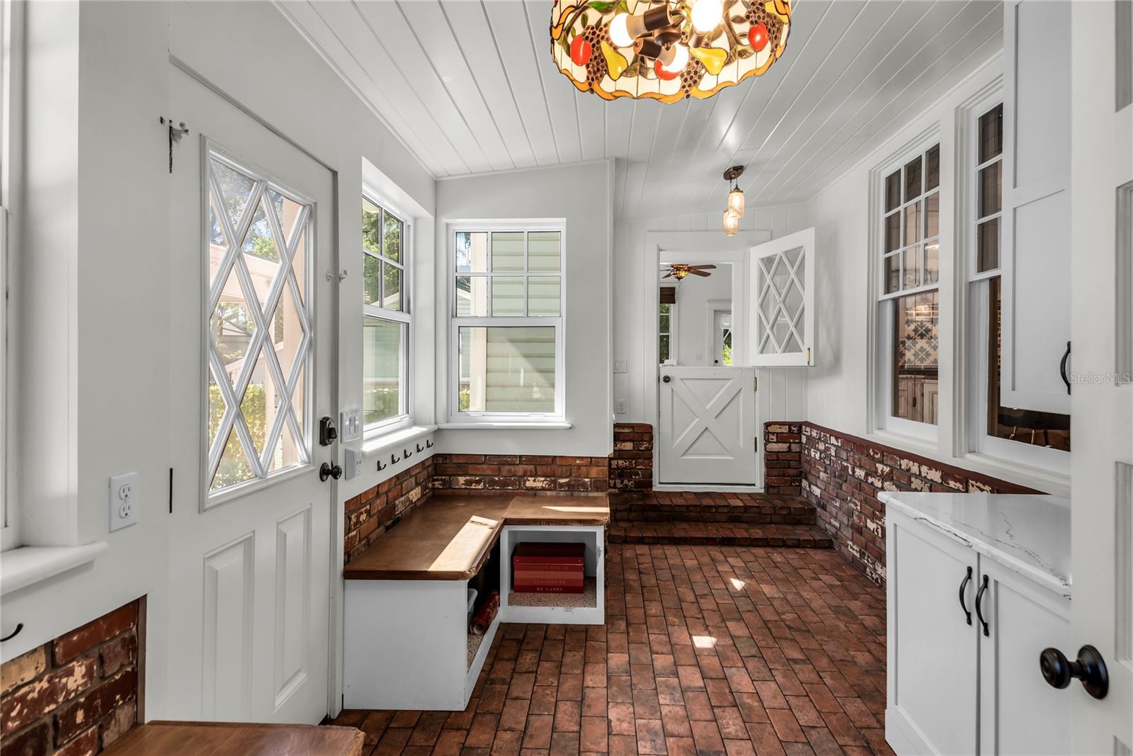 Spacious Mudroom provides entry to carport while a granite countertop, cabinets and a large closet offer both convenience and functionality