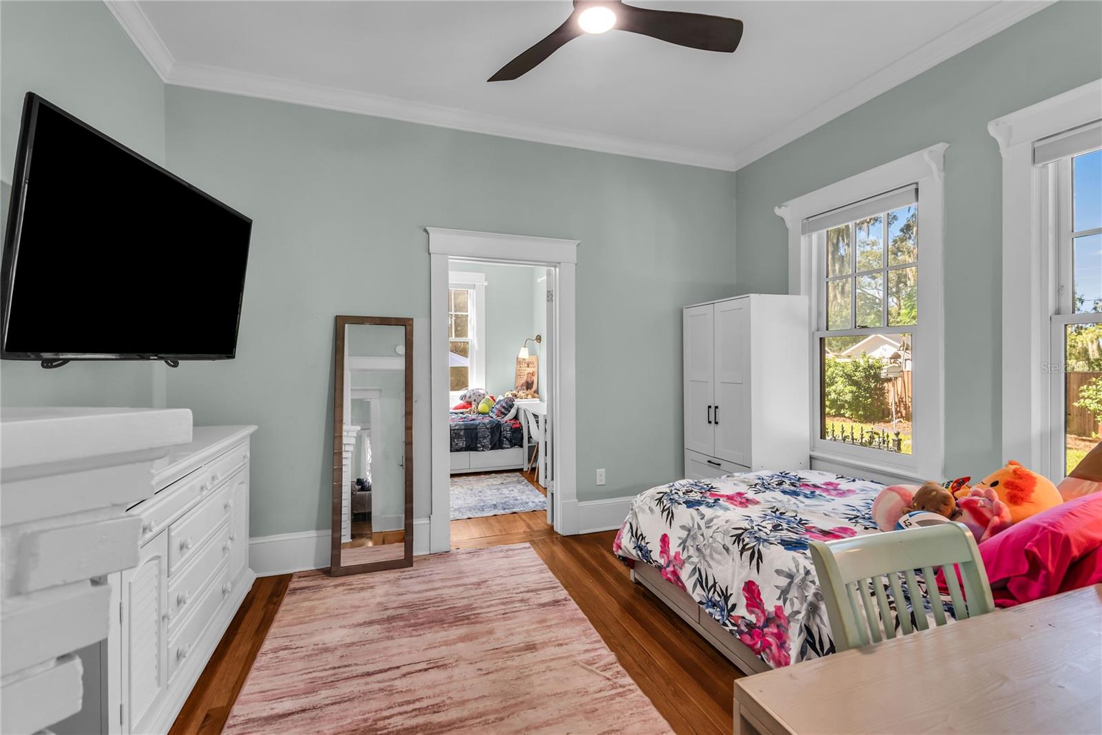 Bedroom 3 with original decorative fireplace