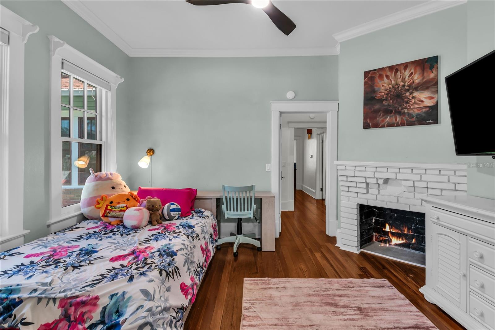 Bedroom 3 with original decorative fireplace
