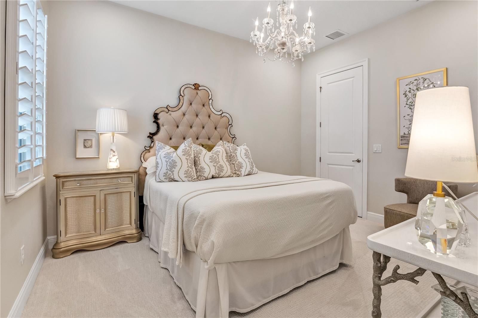 Another perspective highlighting the bedroom's elegant details and neutral finishes.