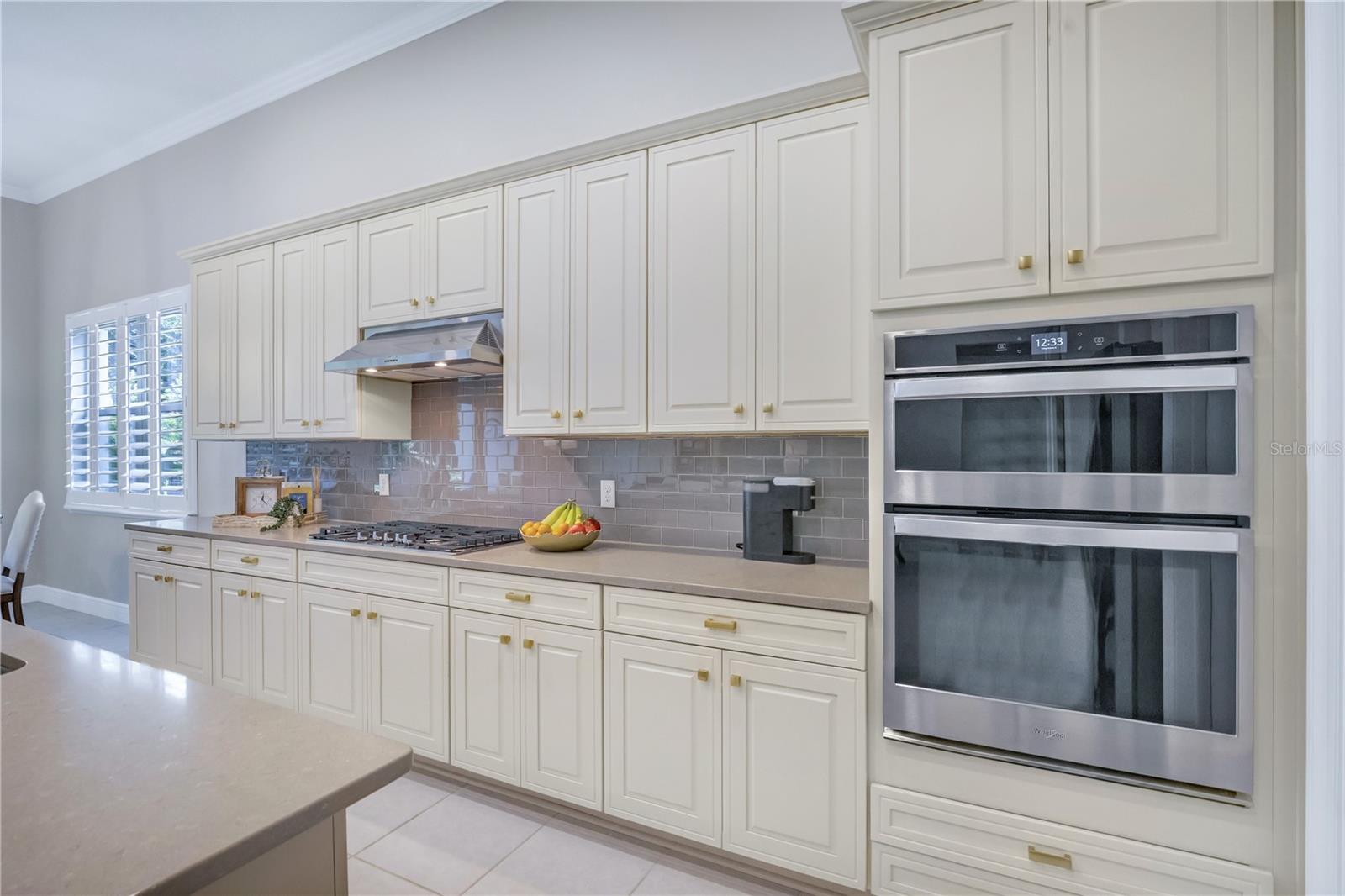 Beautifully appointed kitchen featuring generous counter space and stylish finishes.