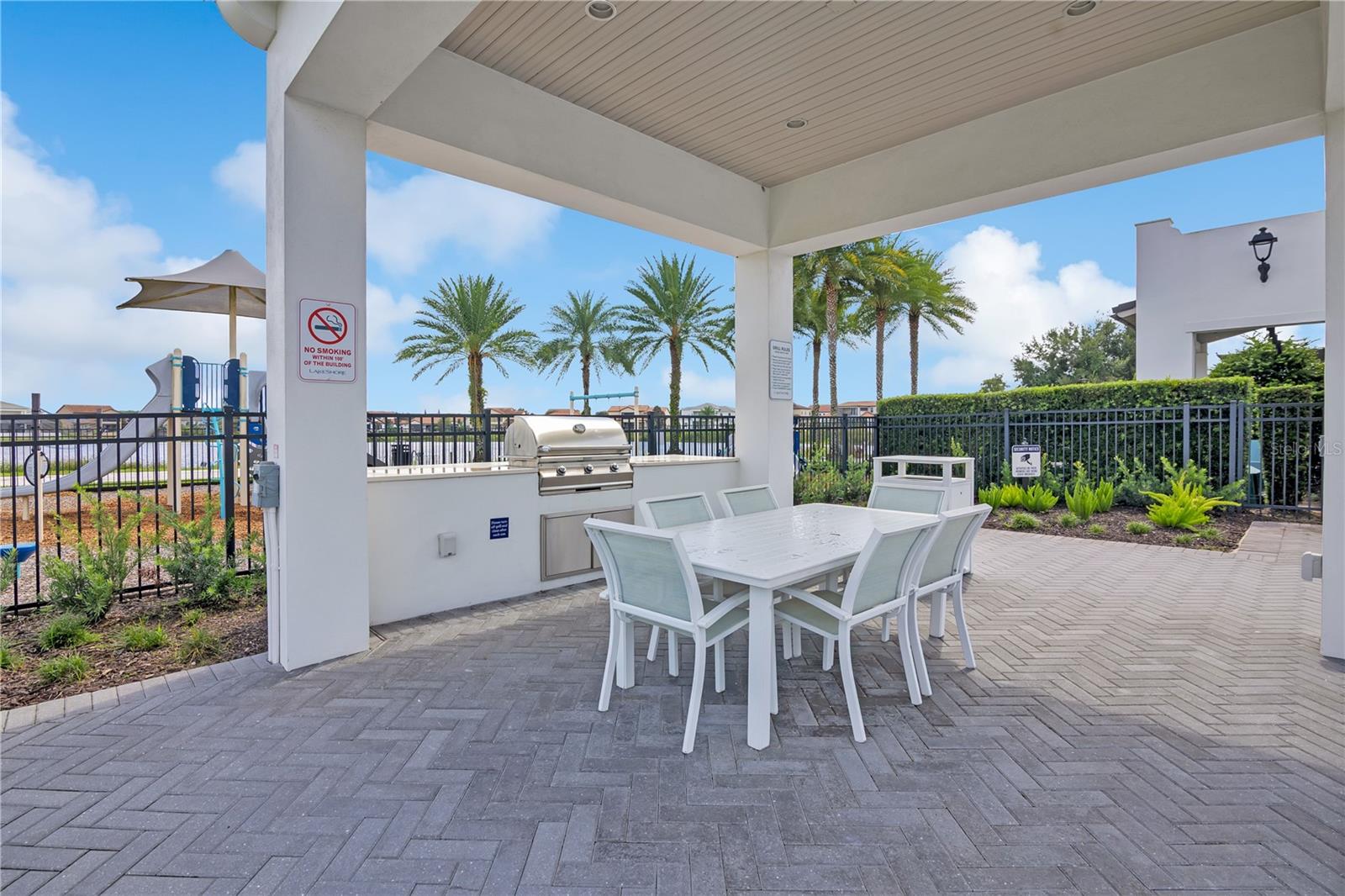 Covered community grilling and dining area, perfect for outdoor gatherings.