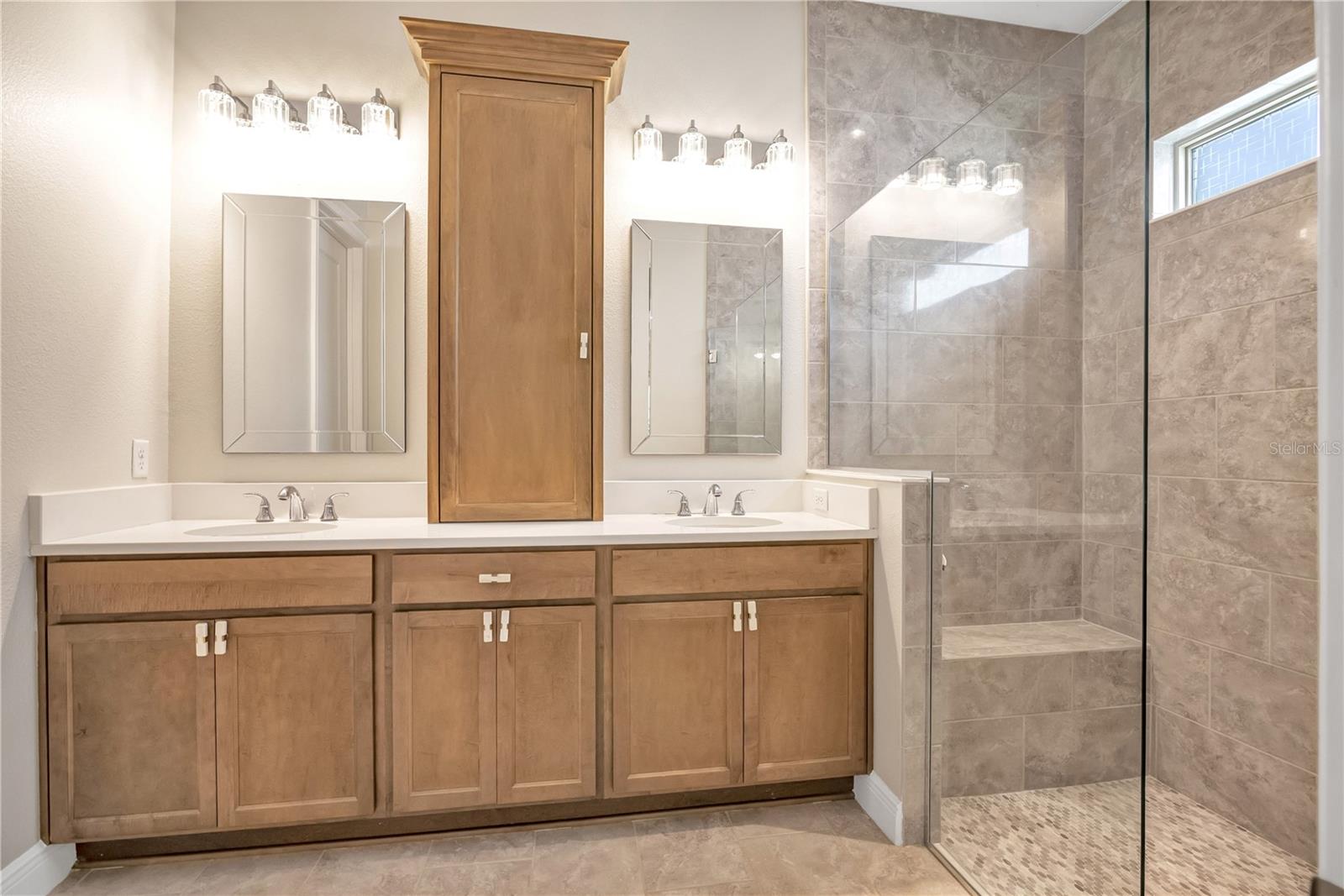 Bright bathroom featuring a contemporary vanity and stylish fixtures.