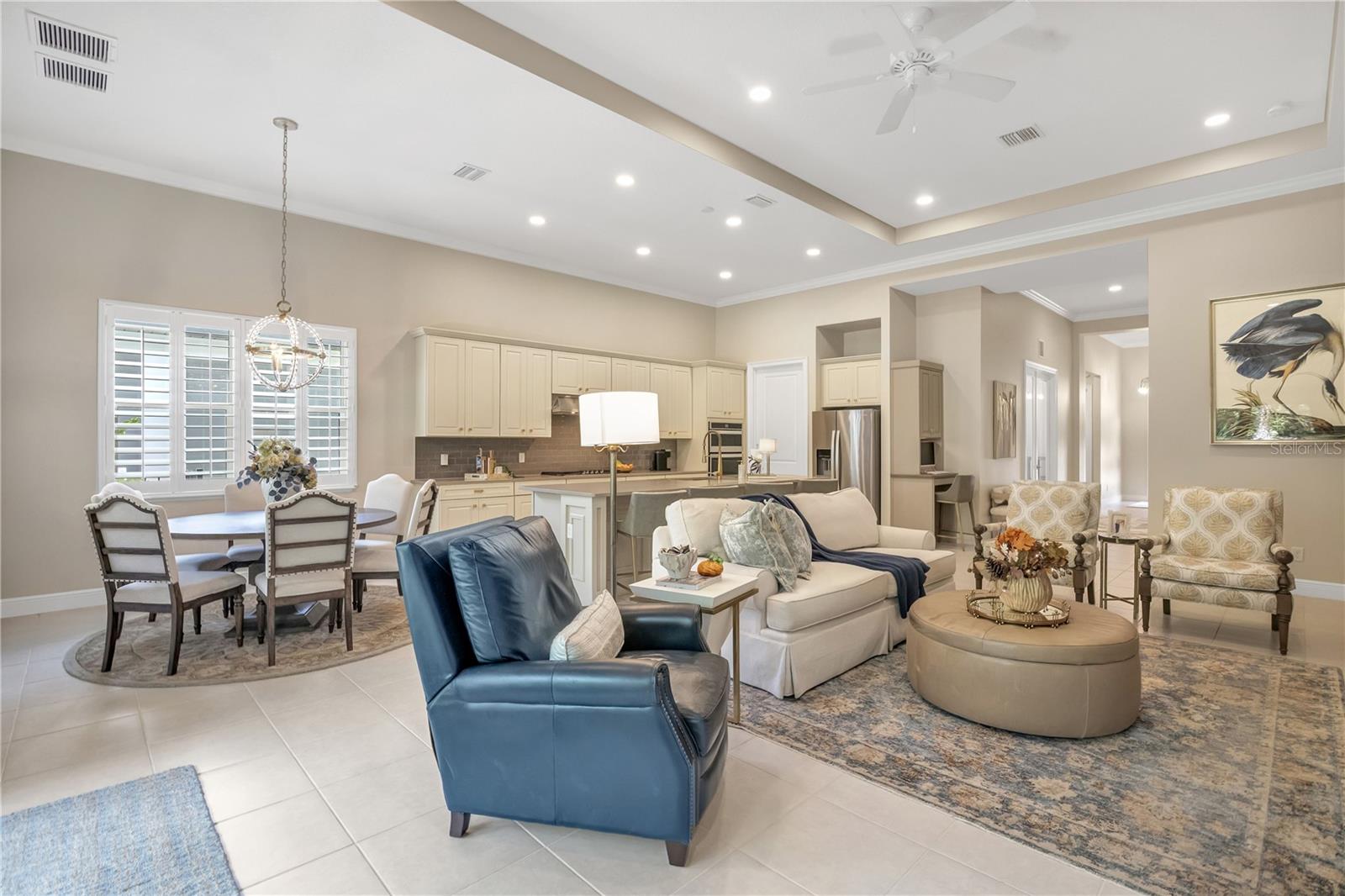Spacious living area filled with natural light, perfect for relaxing or entertaining.