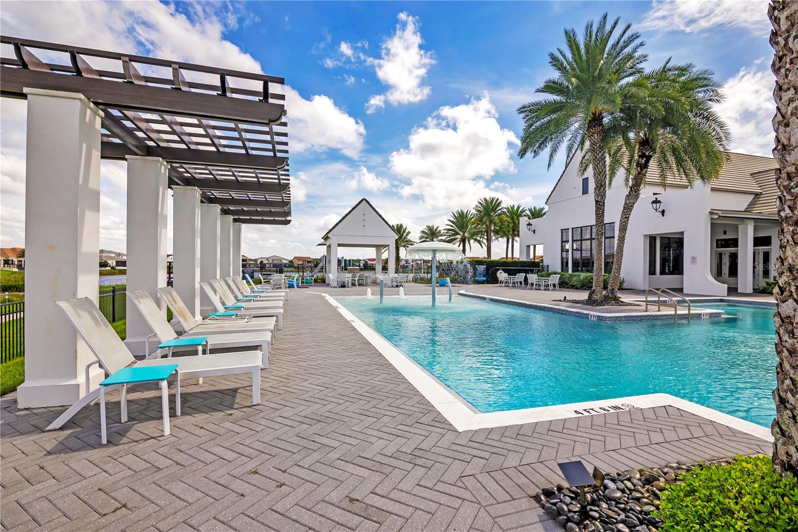 Enjoy the Florida sunshine from comfortable poolside seating and shaded relaxation areas.