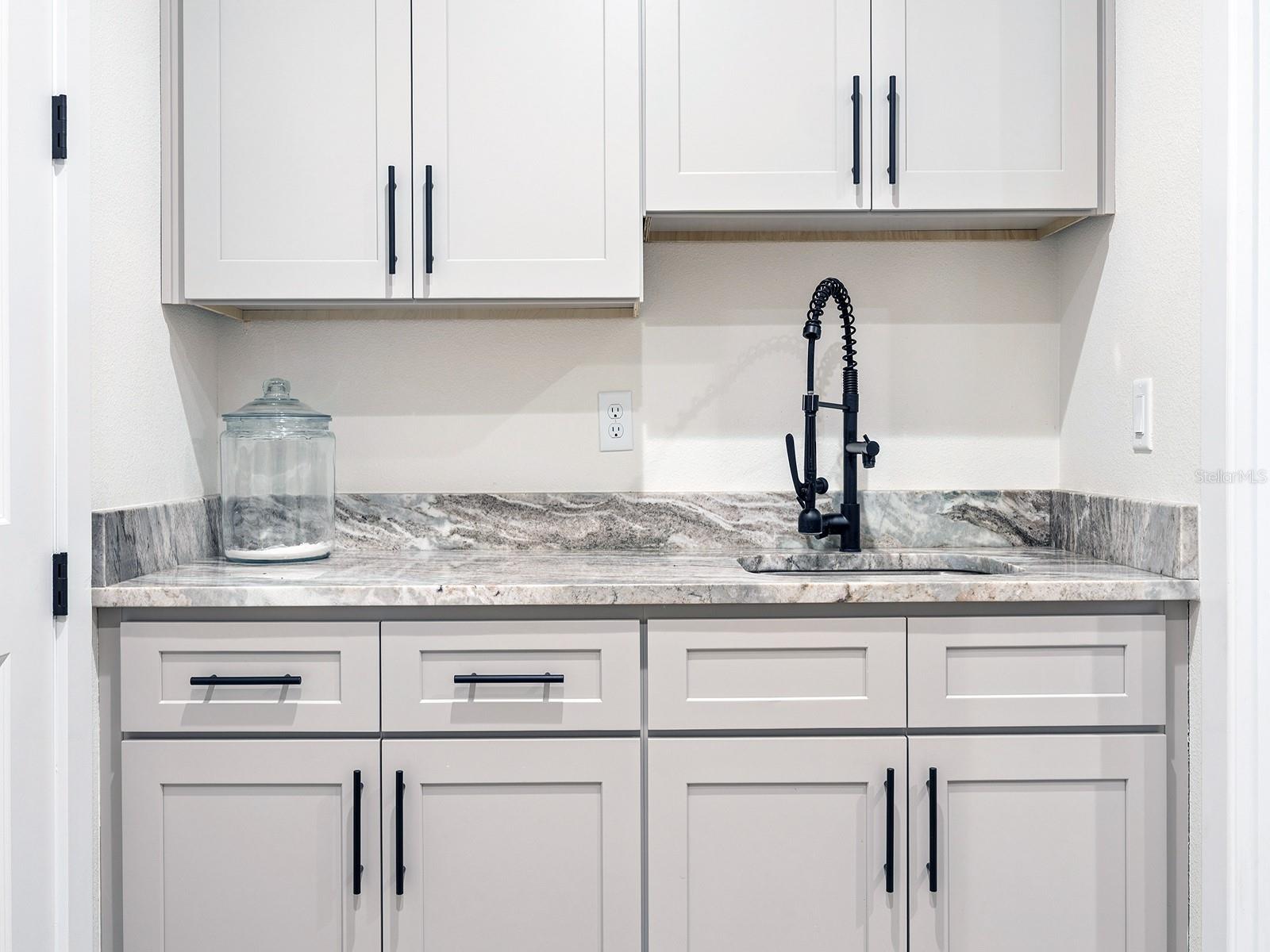 Laundry room sink and cabinets
