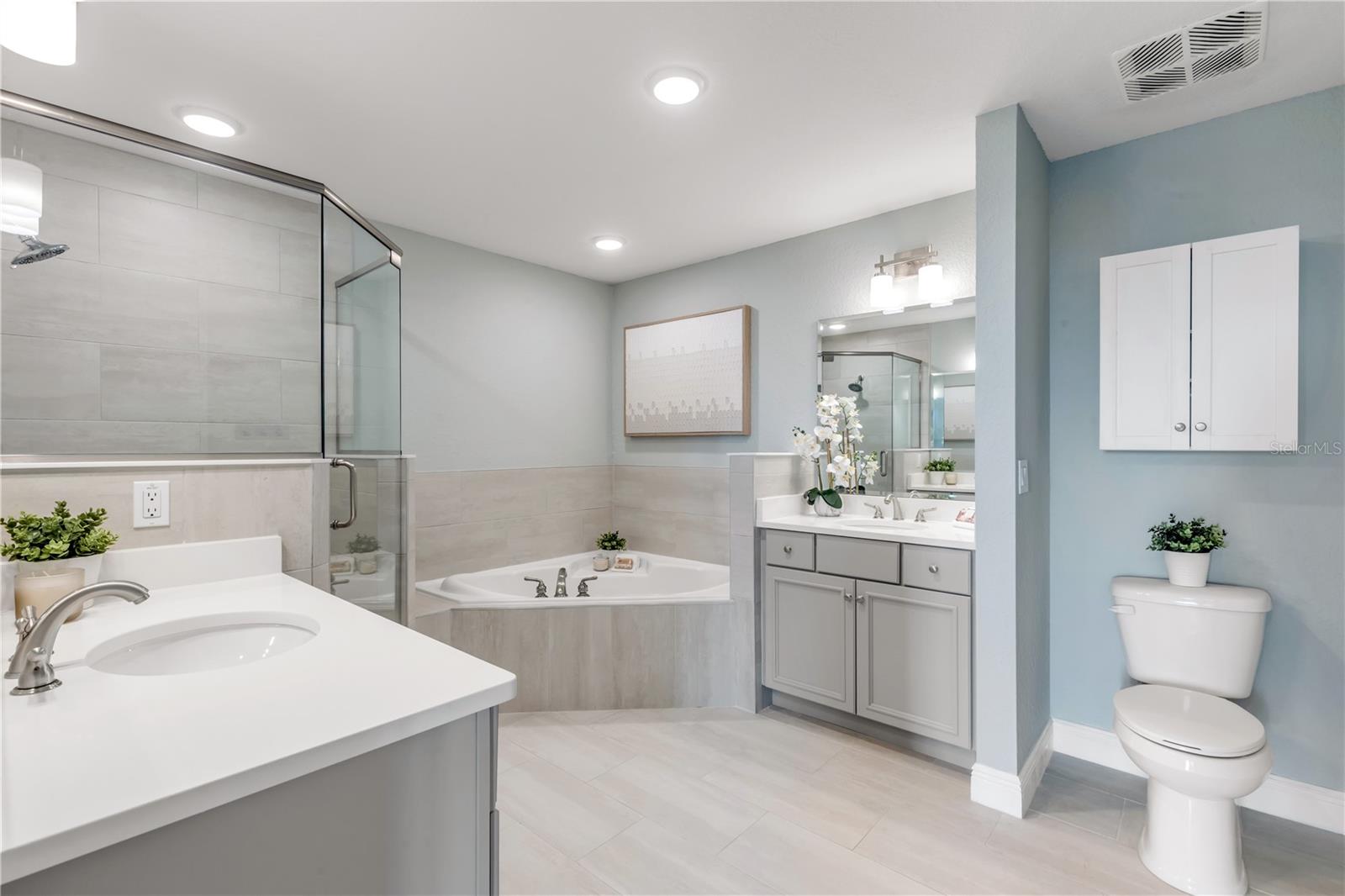 Primary bathroom with dual vanities