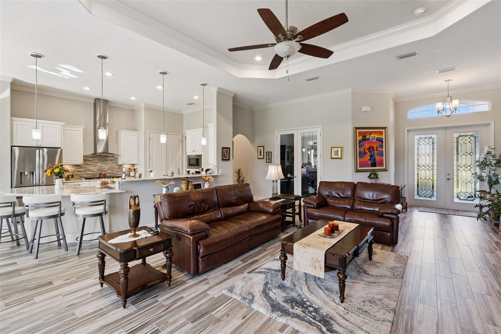 Beautifully updated kitchen featuring an expansive breakfast bar with seating for eight, seamlessly overlooking the spacious family room.