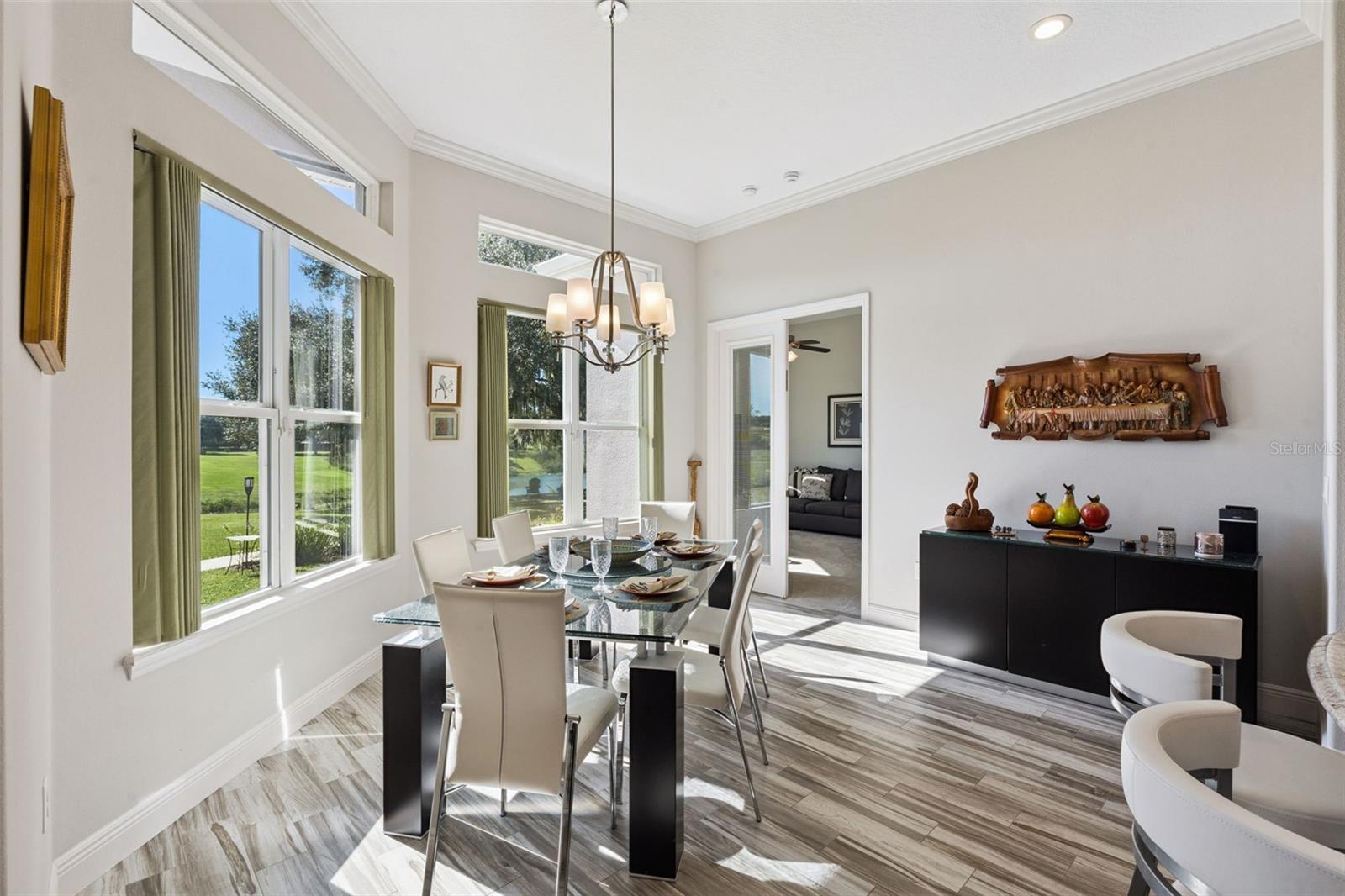Casual dining and french doors that lead to bedroom 4/In law suite