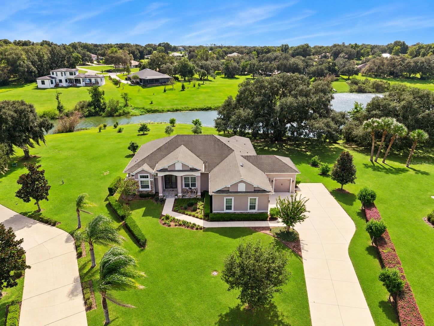 Welcome home to your lake front estate complete with 4 bedrooms, an office and a 3 car garage