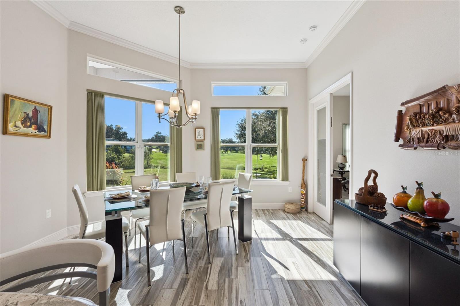 Enjoy expansive views with transom windows, complemented by a light, neutral paint palette that enhances the bright and airy atmosphere.