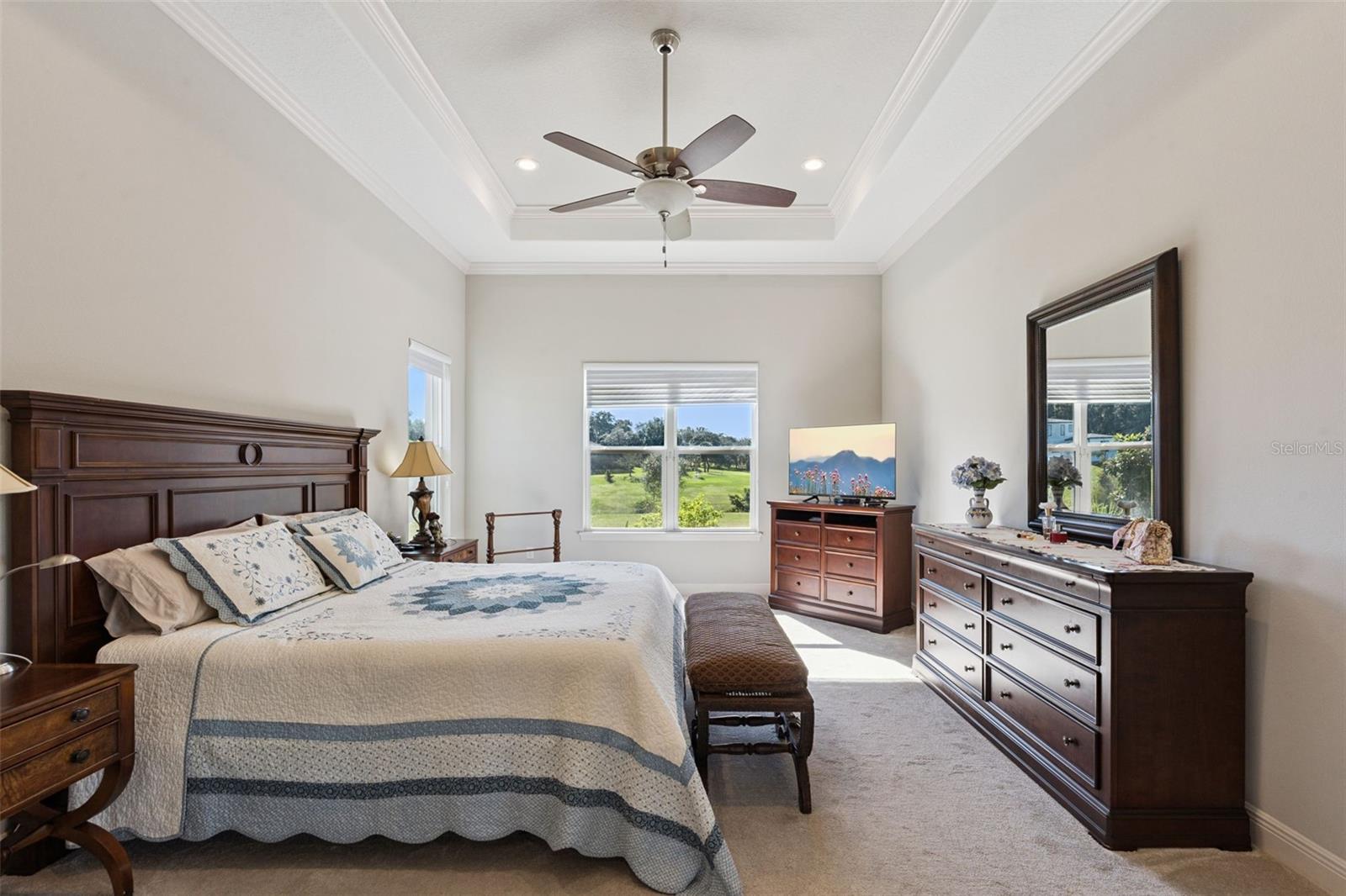 Private primary suite featuring a serene, expansive water view that brings tranquility into the living space.