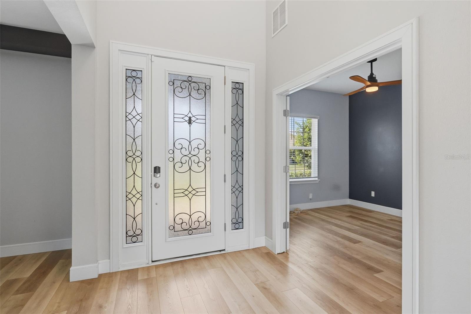 Entrance with dining area on one side and office on the other