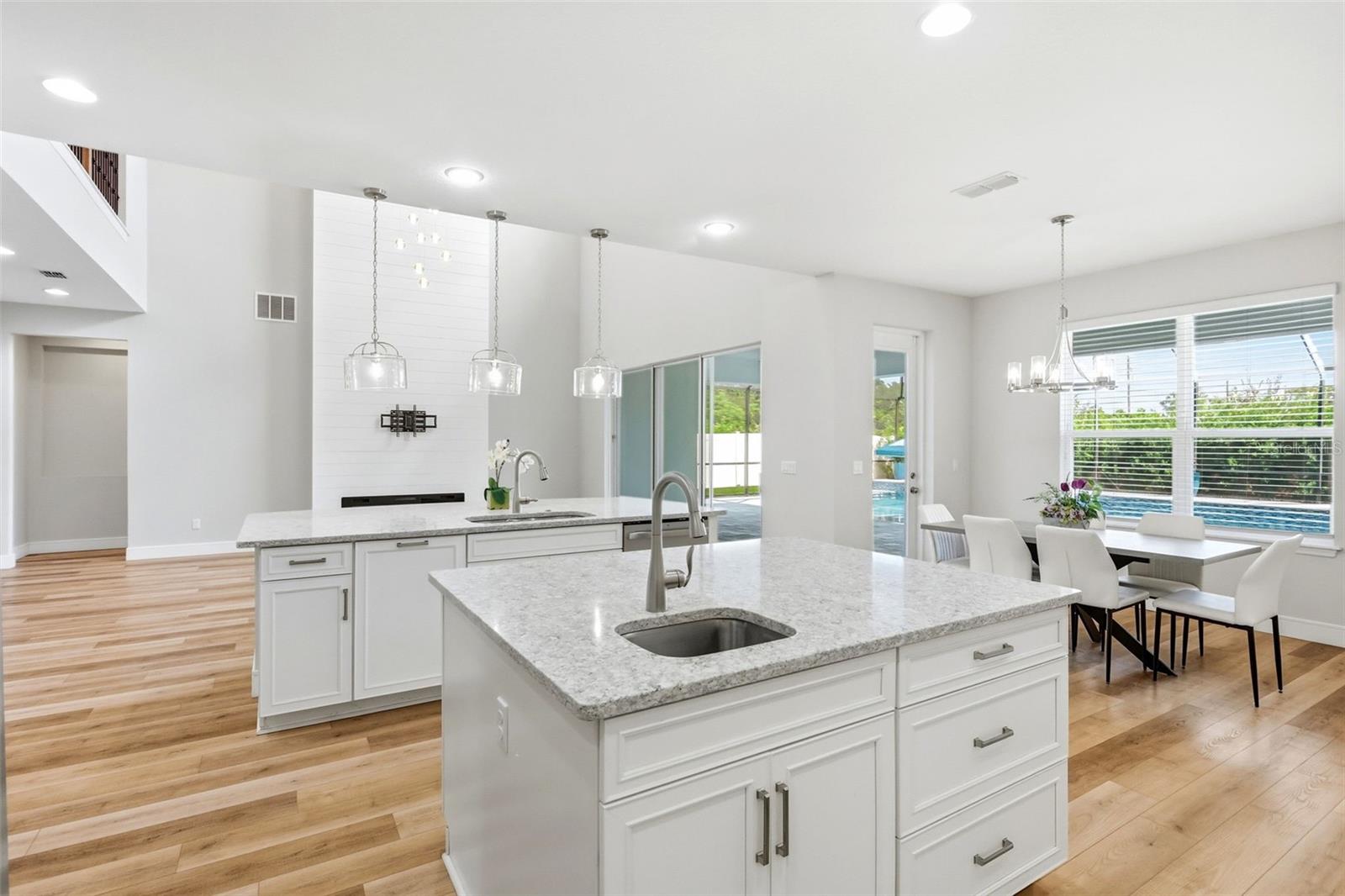 Kitchen open to the living area nd includes two islands and a spacious breakfast nook