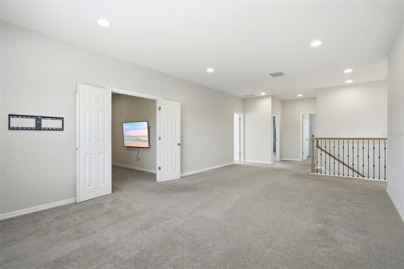 Double door lead into the separate media room