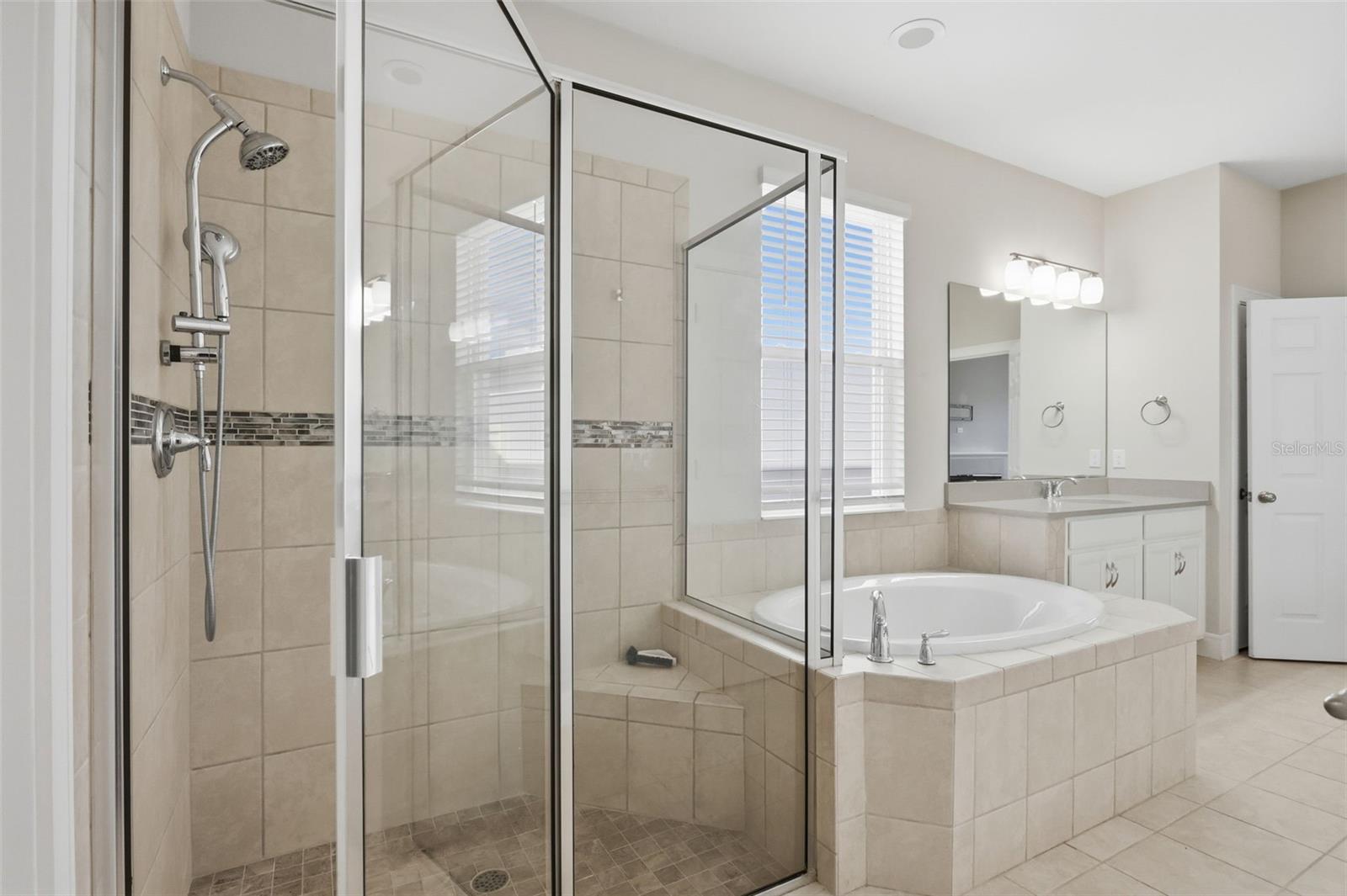 Walk-in Shower and garden tub in the primary bathroom