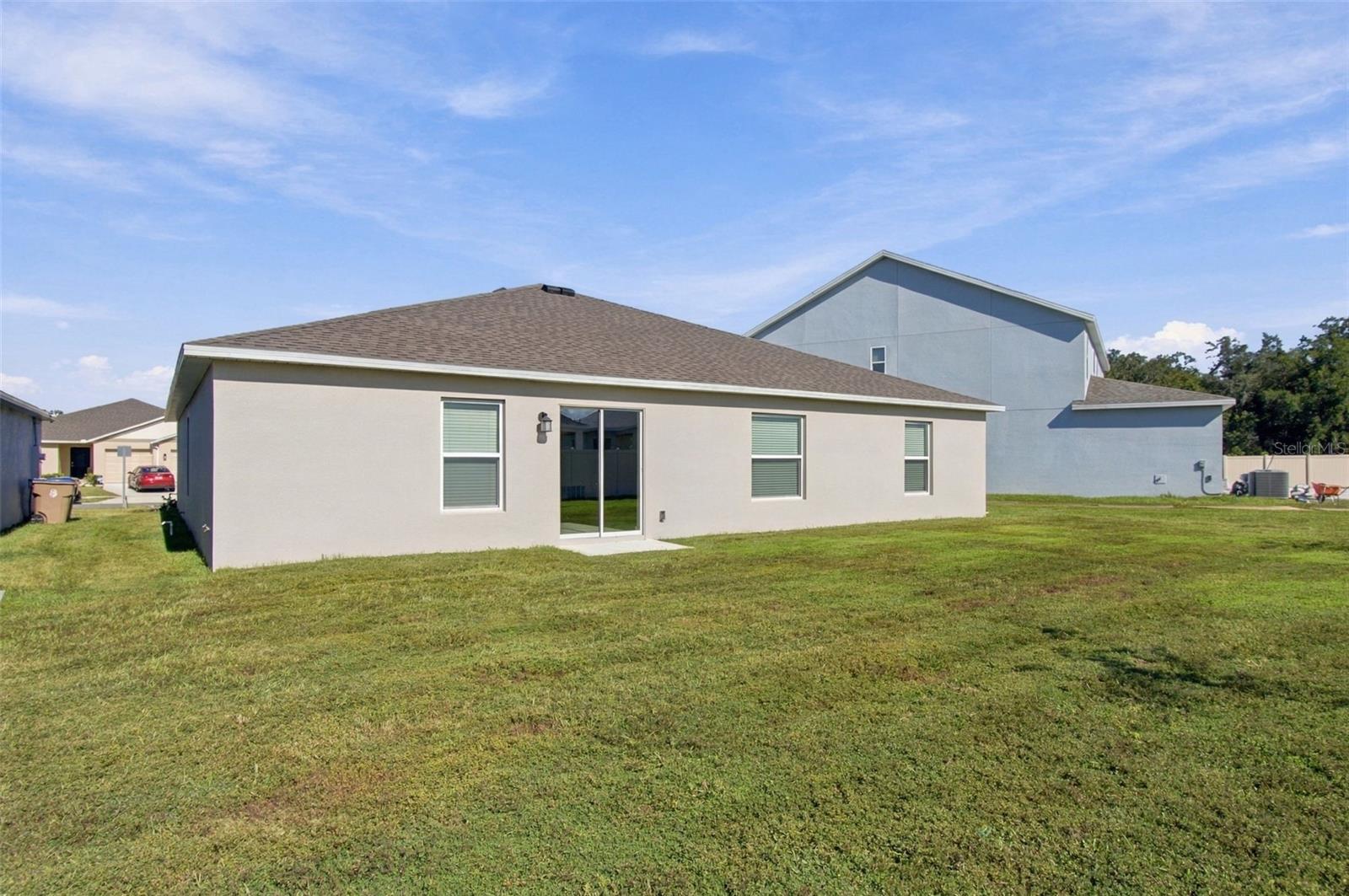 Enjoy the outdoor patio and spacious backyard, with plenty of room to add a fence.