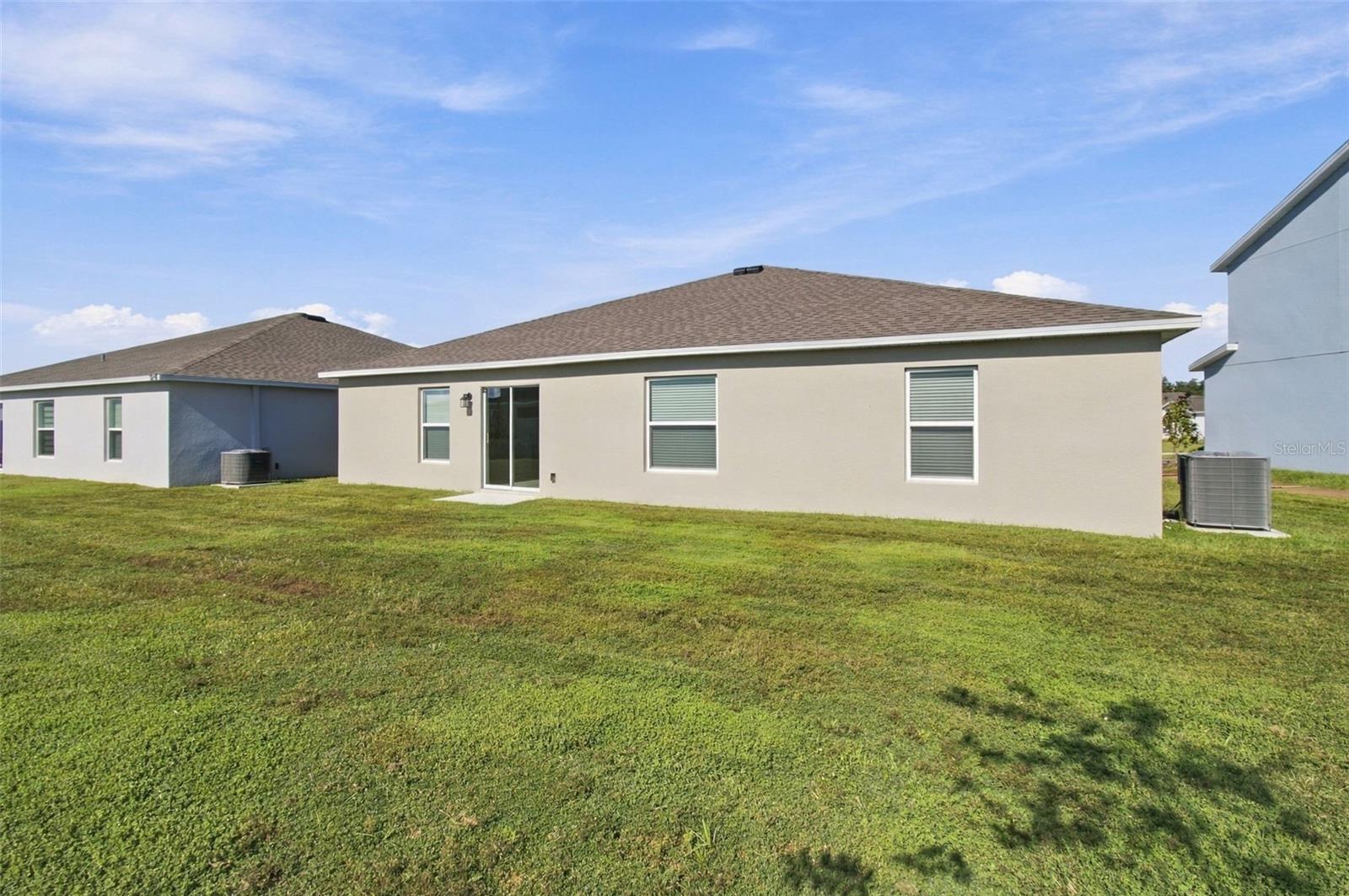 Enjoy the outdoor patio and spacious backyard, with plenty of room to add a fence.