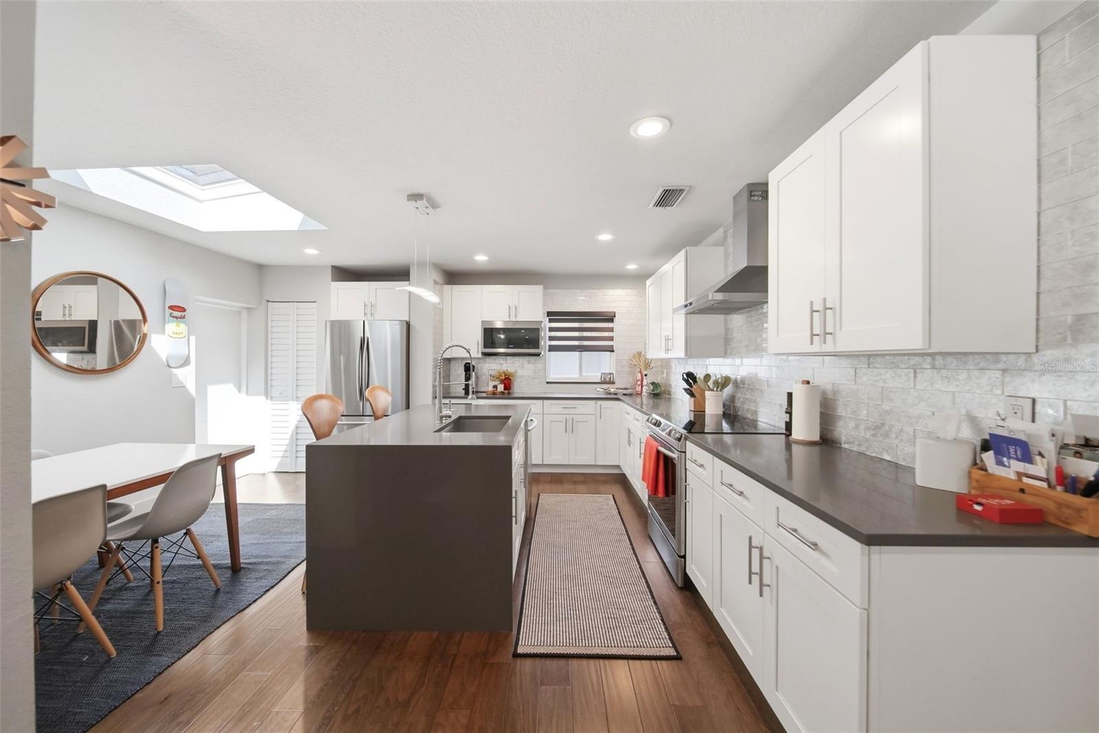 The skylight allows natural light to pour into the dining area and kitchen
