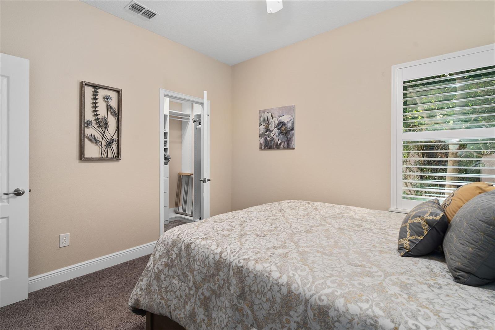 Bedroom 2 offers a Walk-in Custom Organized closet