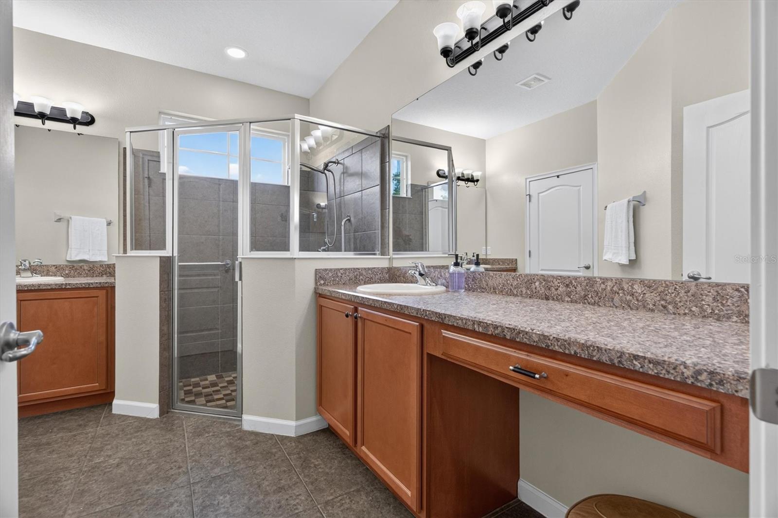 Primary bathroom with split vanities