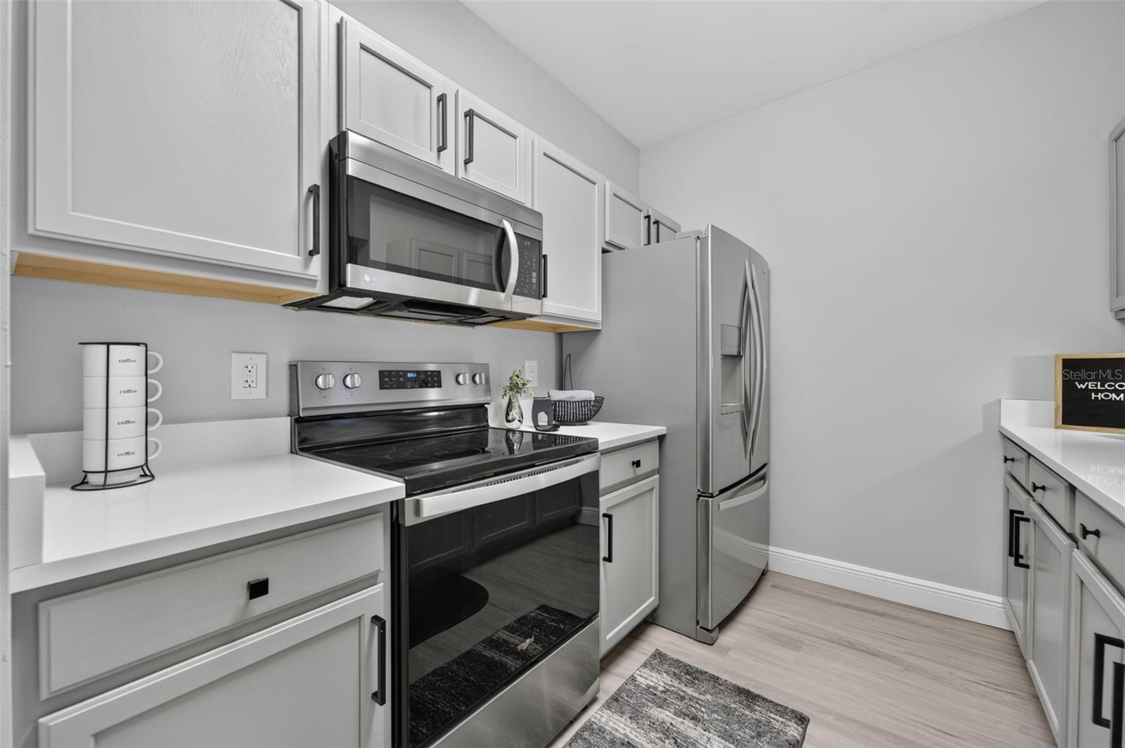 Kitchen range, microwave and refrigerator