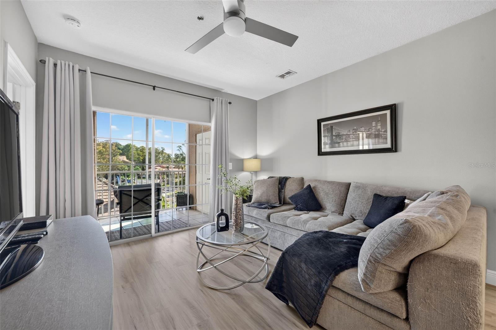 Living room sectional and sliding door to balcony