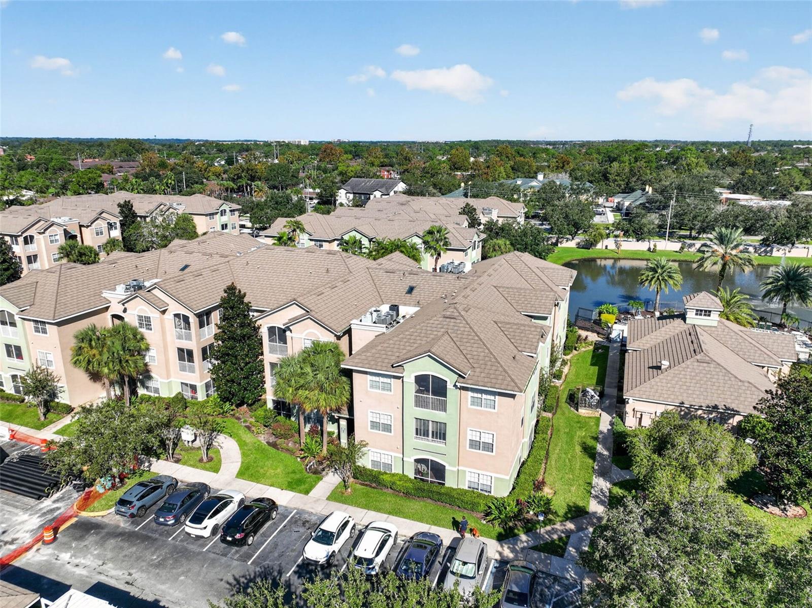 Aerial view of building, grounds and pond