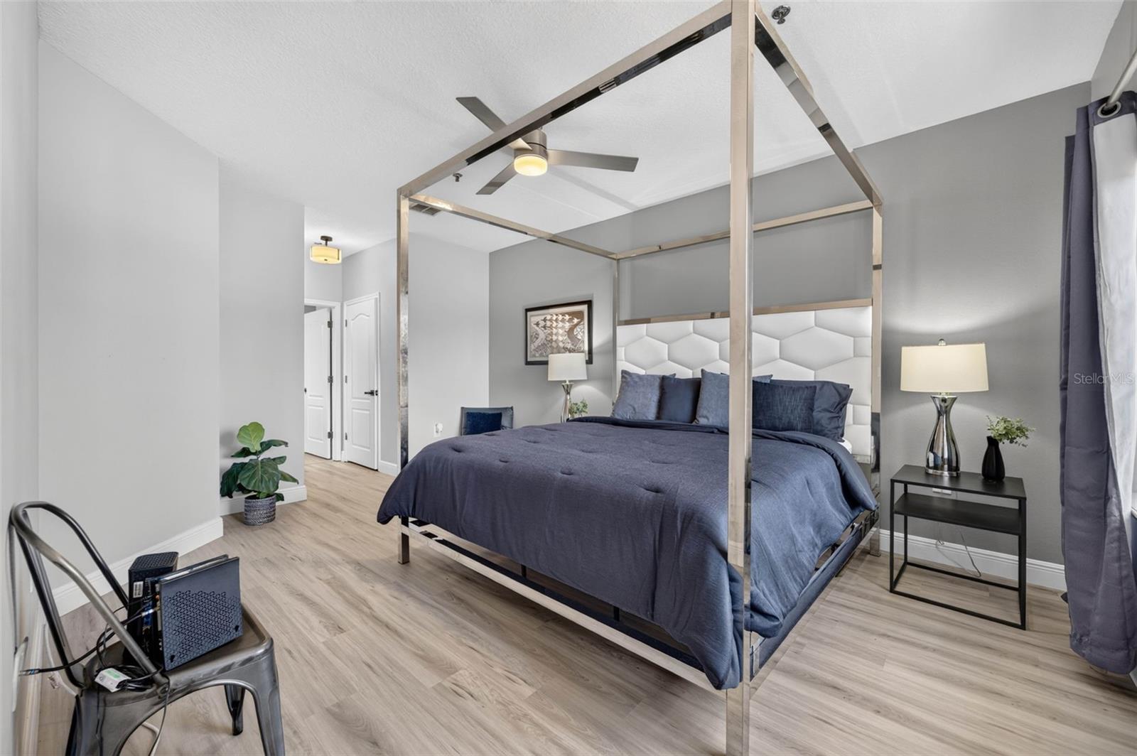 Primary bedroom with canopy bed