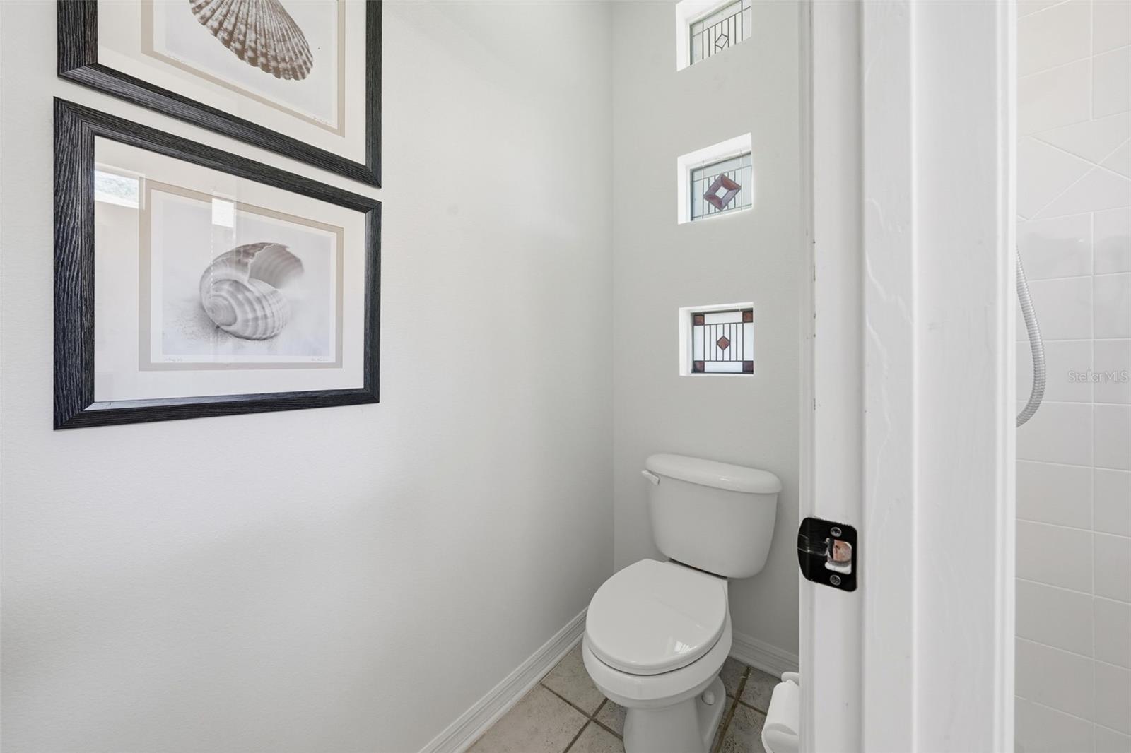 WATER CLOSET IN THE PRIMARY BATHROOM