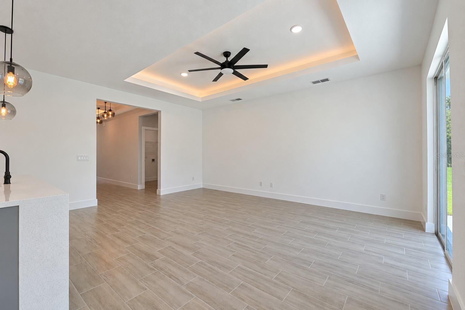 Living room reverse view. Digitally edited model/property composite.