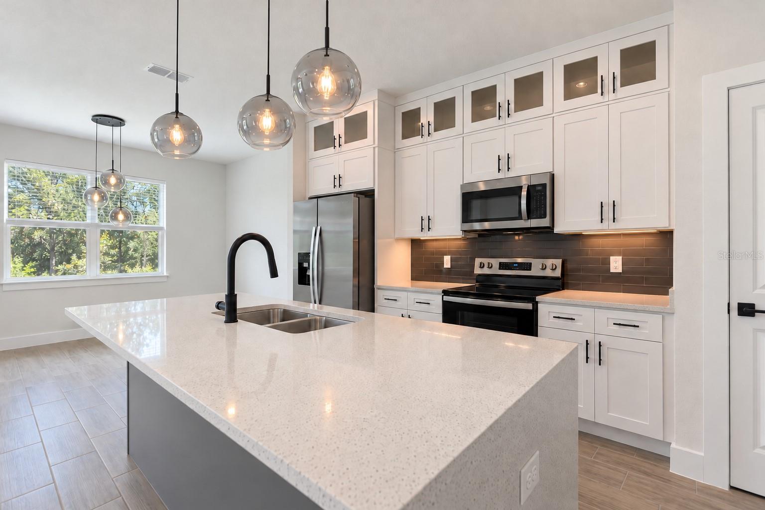 Kitchen sink angle. Digitally edited model/property composite.