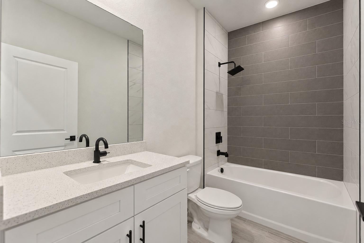 Guest bathroom. Digitally edited model/property composite.