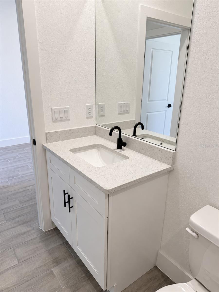 Guest vanity detail. Actual property photo, digitally refined.