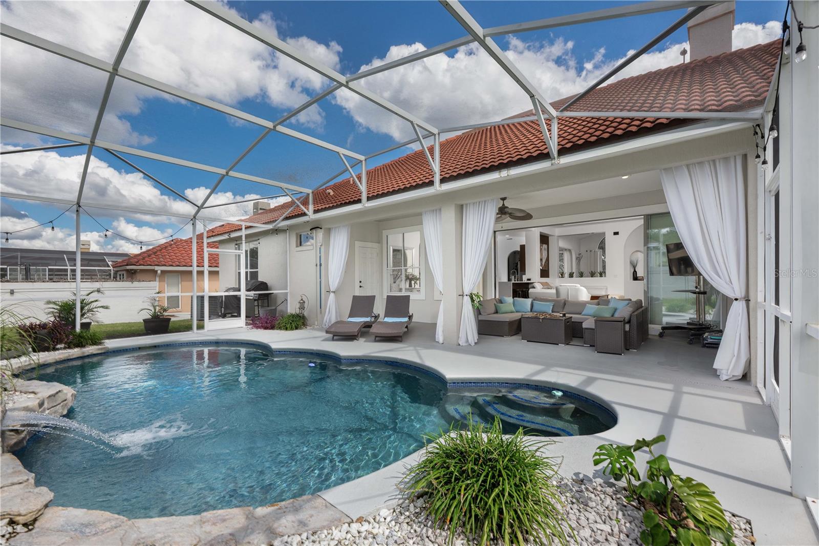 Spacious backyard oasis featuring a relaxing salt pool.
