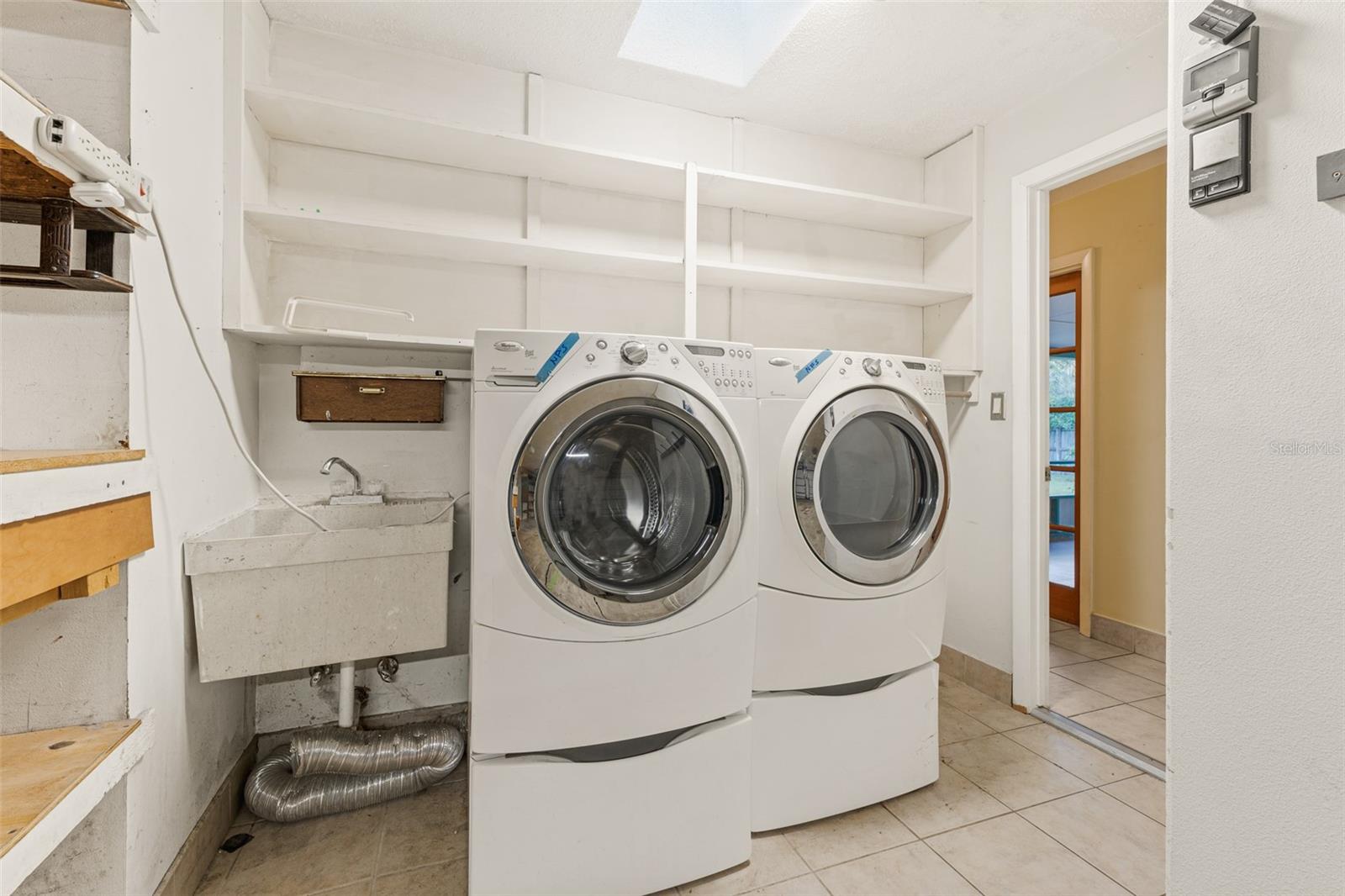 Laundry with Built-In Shelving, Sink