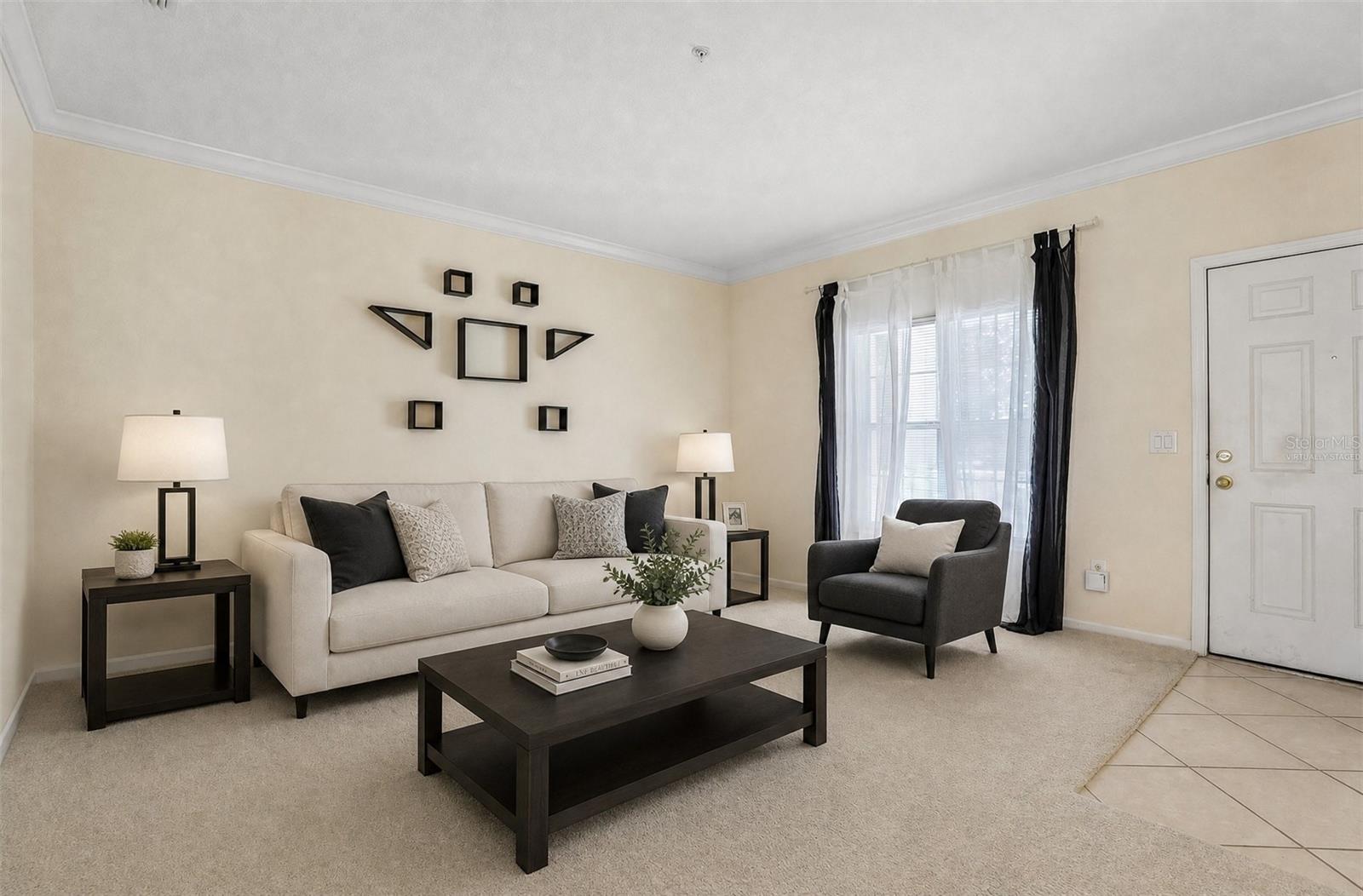 Formal living at the front of the home. Virtually Staged.