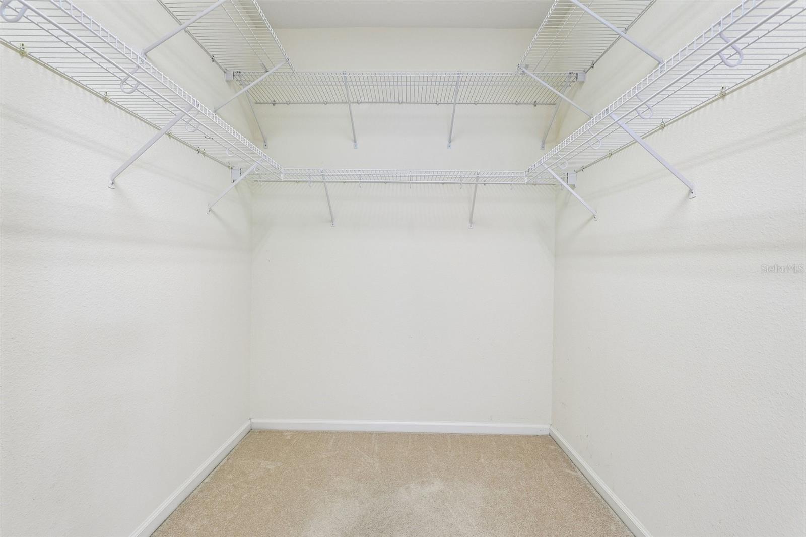 Primary suite walk-in closet.