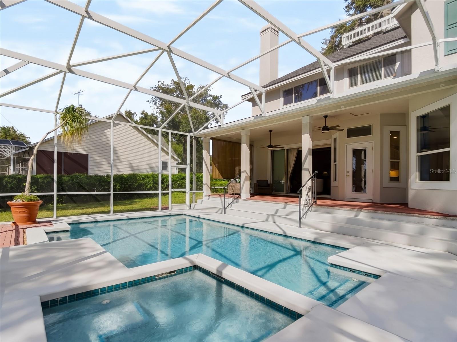 Heated pool and spa with enclosure