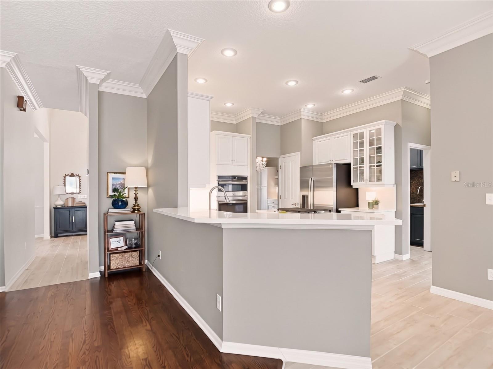 Refreshed gourmet kitchen opens to Living Room