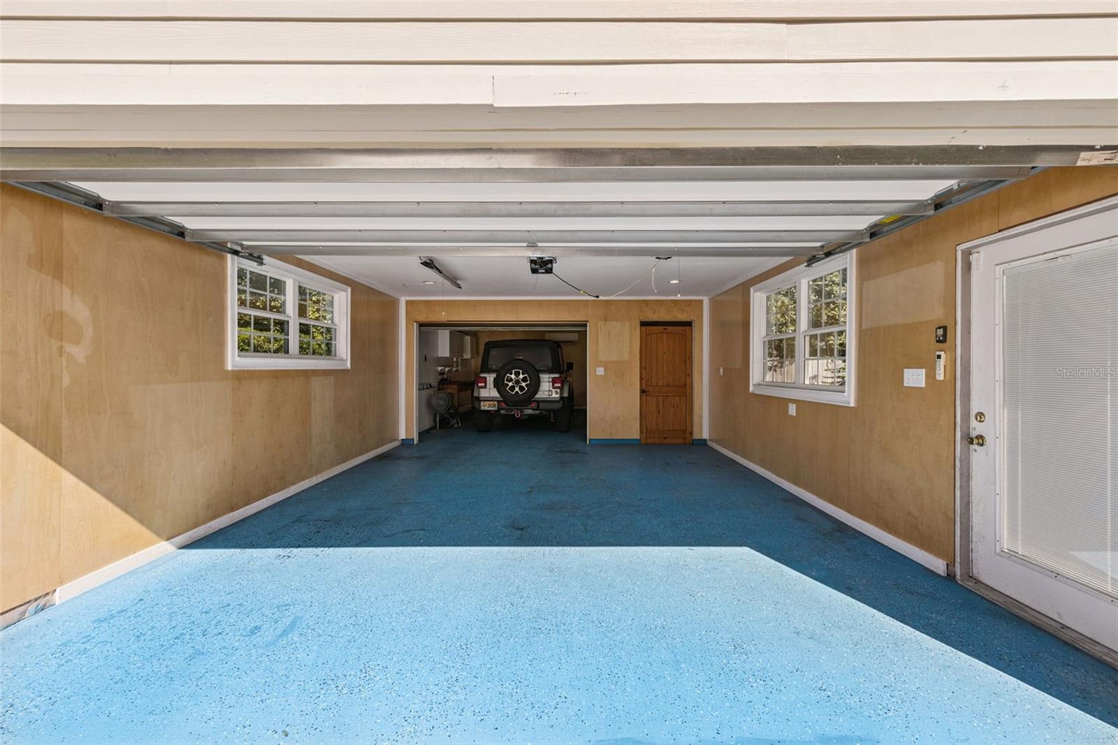 Another look at the Tandem garage with the backside currently holding a 4 door jeep and electric bikes, perfect for heading downtown on the bike trails; or over to the Hourglass Brewery and Claddagh Cottage just around the corner.