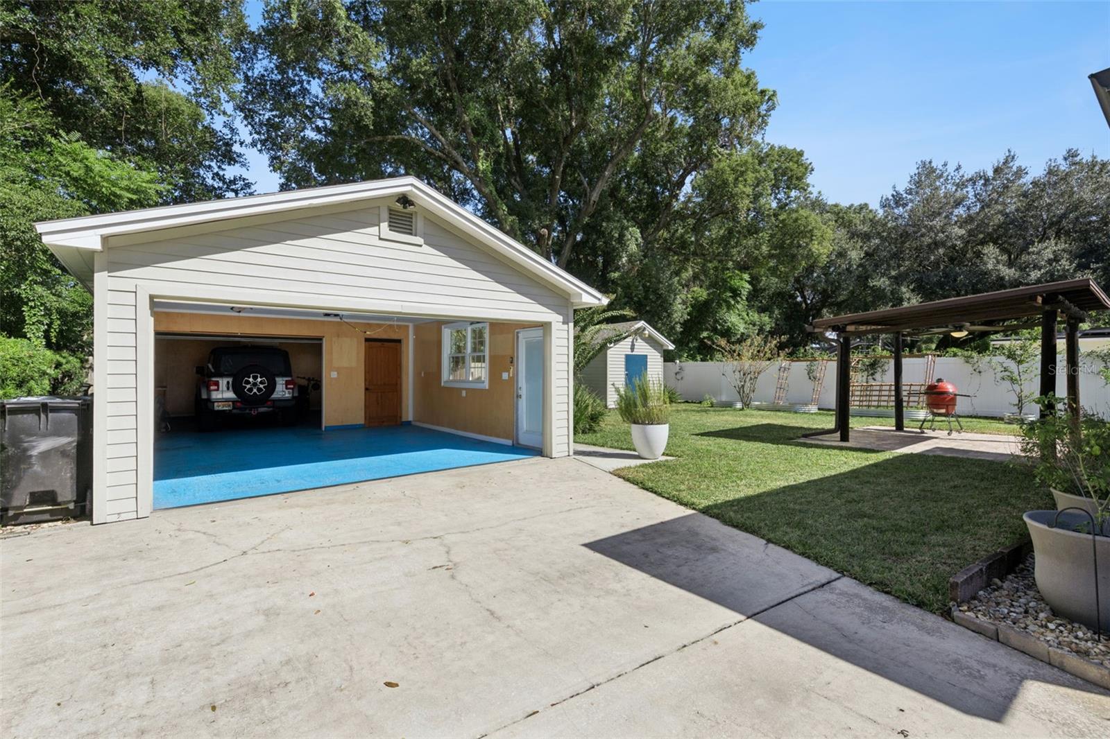 Views of the garage, gazebo and grass area.