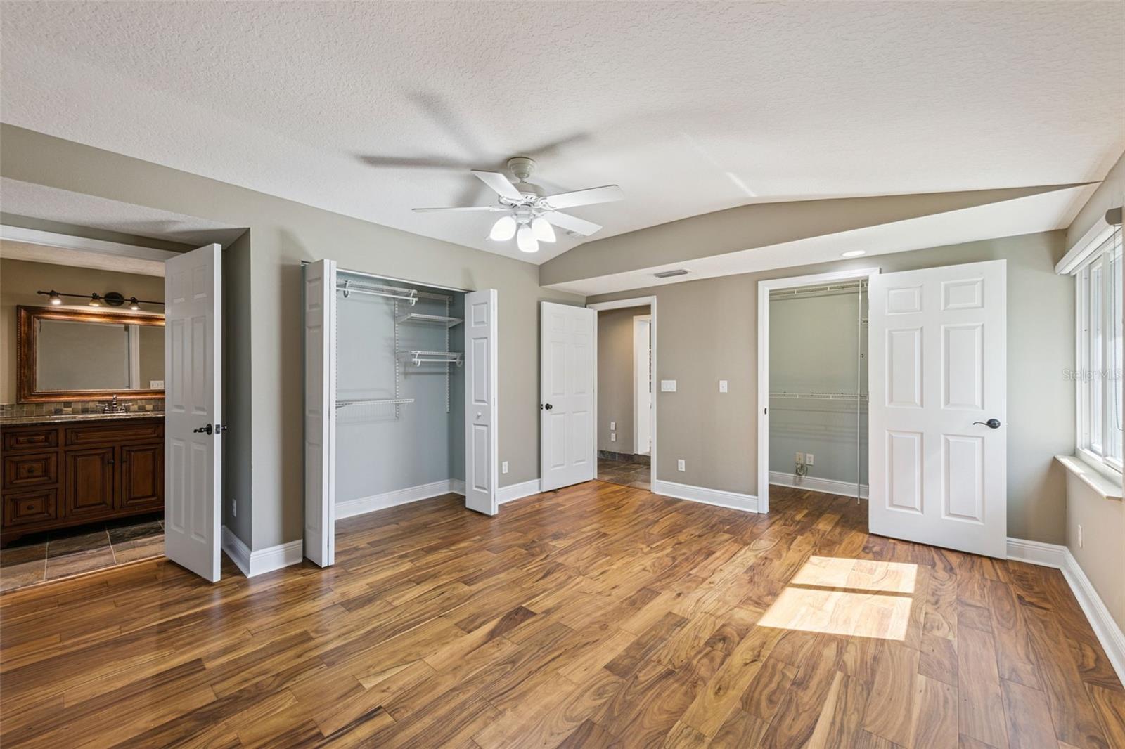 Huge Primary Bedroom with 2 large closets and new wood luxury vinyl flooring
