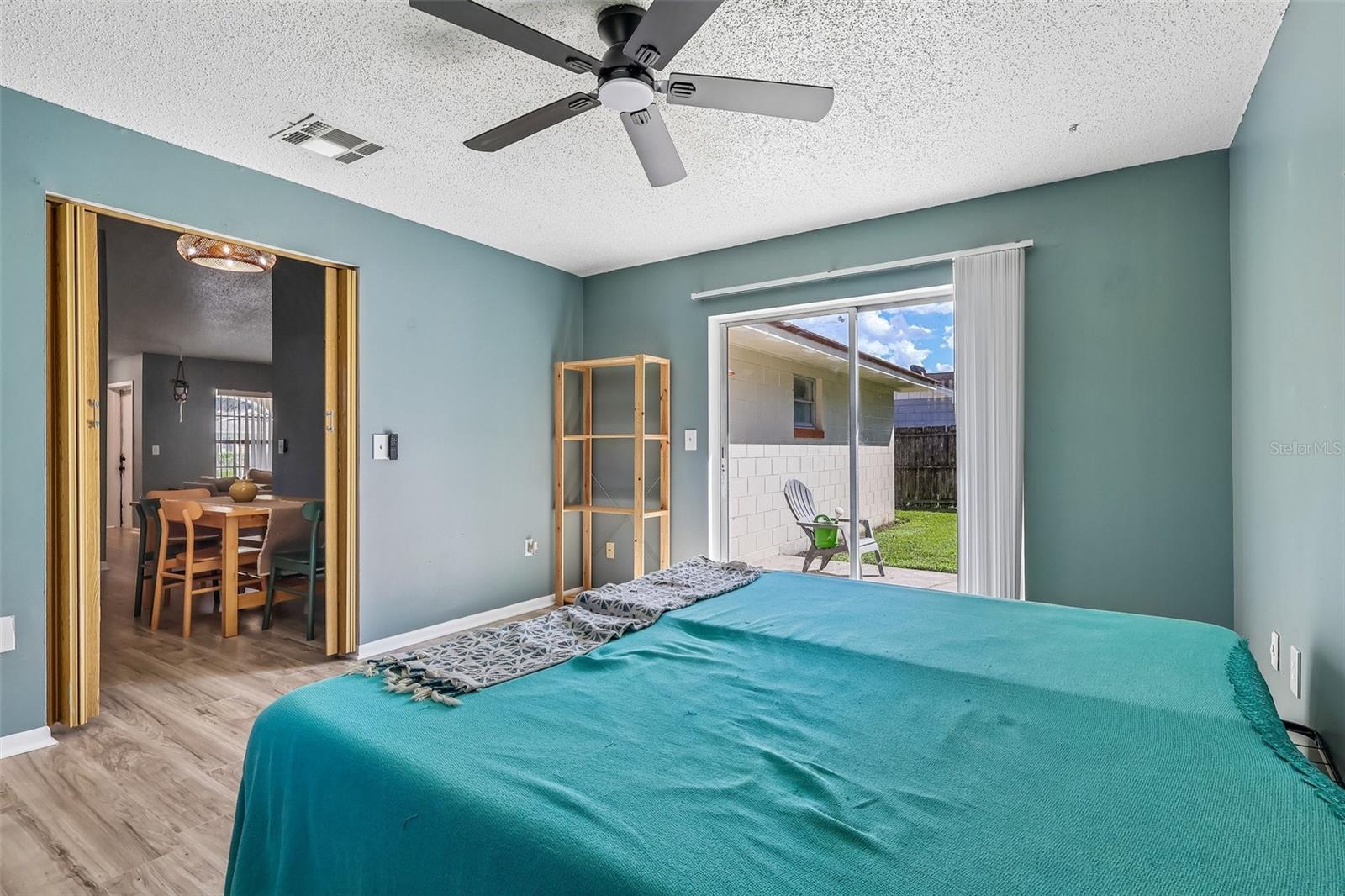 There is a partition to close off this room for privacy as well as a sliding glass door to access the backyard