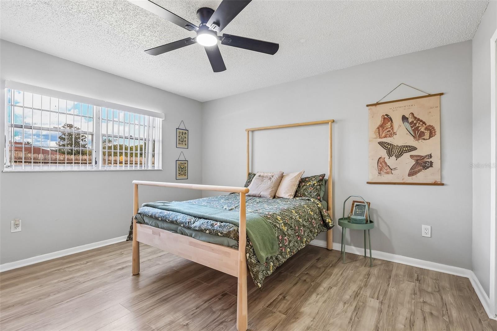 Welcome to your primary retreat! The wood-look vinyl flooring transitions nicely to the bedrooms