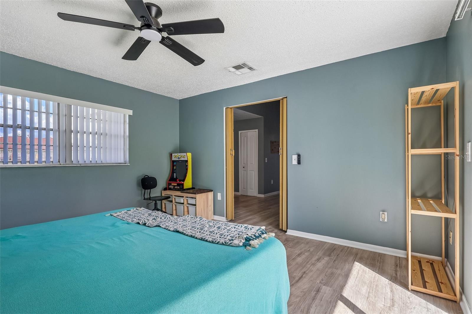 The bonus room also has a great window for natural light and a ceiling fan