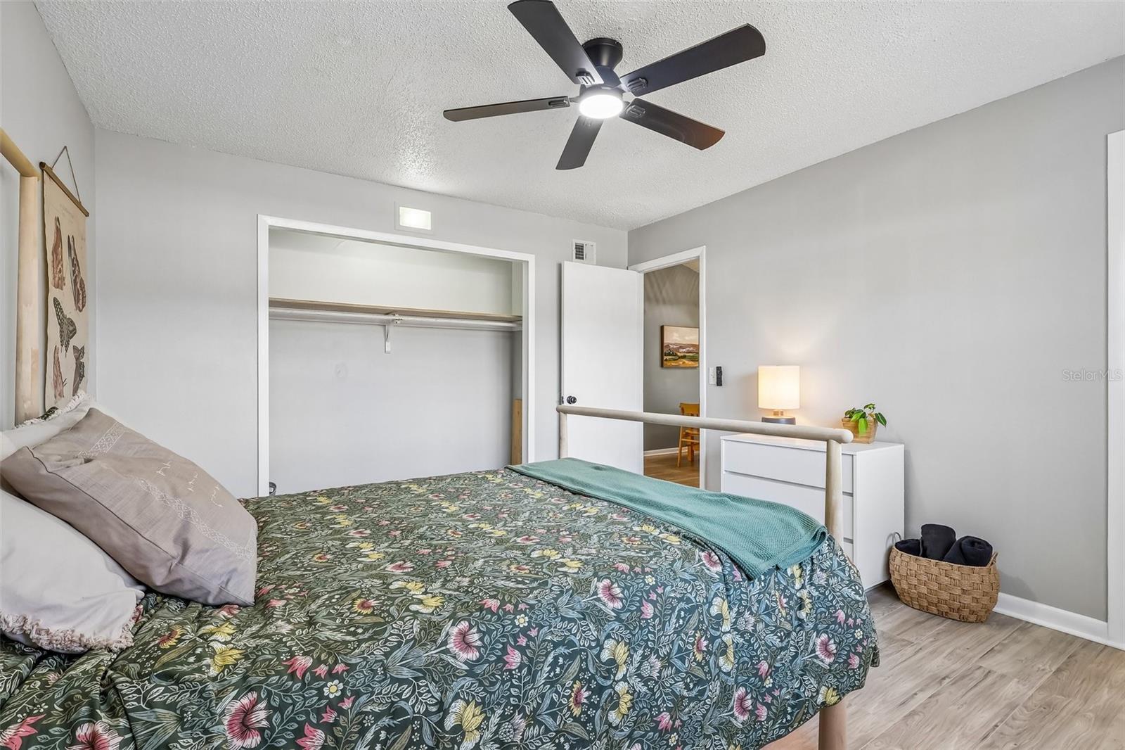 You have a spacious closet and a ceiling fan in the primary bedroom