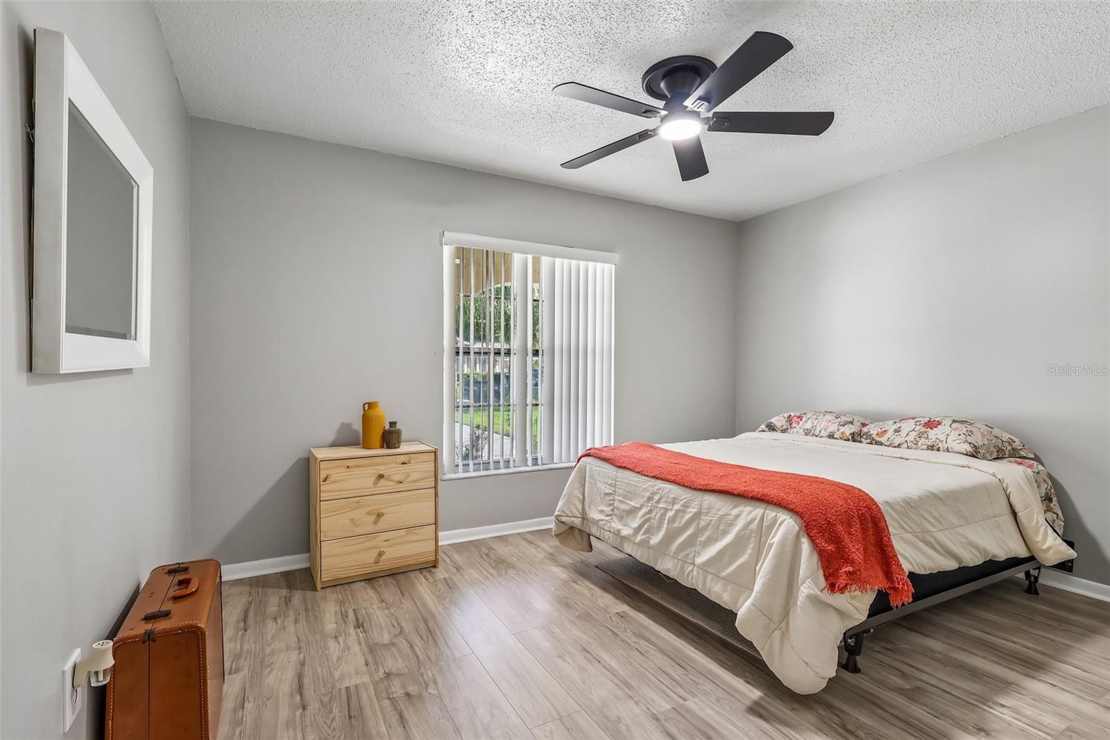 Bedroom 2 has updated vinyl flooring